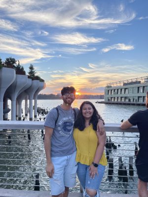 Ghammam Mansoor with his girlfriend Natalie Casanova in front of a scenic water scene