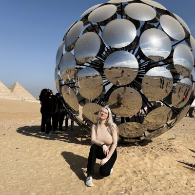 Michelle Skowronek pictured in front of a mirrored orb at the Giza Pyramids