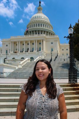 a woman in front of the U.S. Capitol