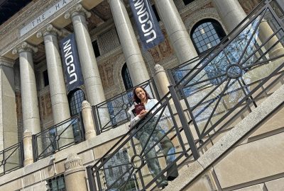 a woman on the staircase of UConn Hartford's campus