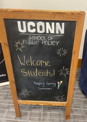 a blackboard with the message "Happy Spring Semester"