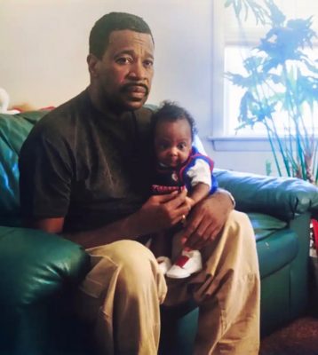 a man holding a baby