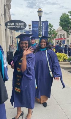 students walk in to graduation ceremony