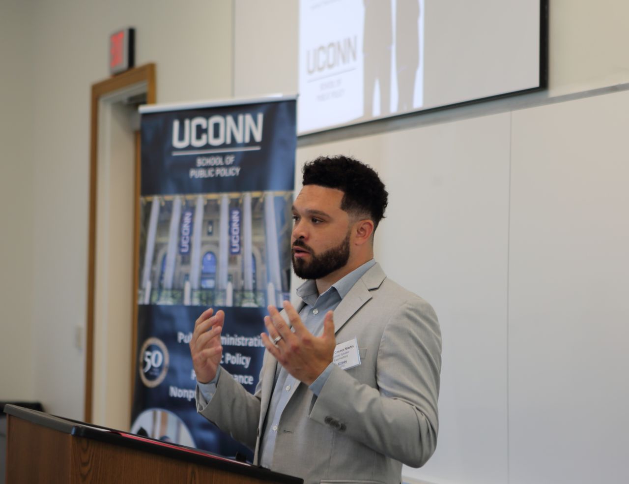 Photo of East Hartford Mayor, Connor Martin, speaking to undergraduate students competing in UConn SPP Local Government Management case competition in June 2026.