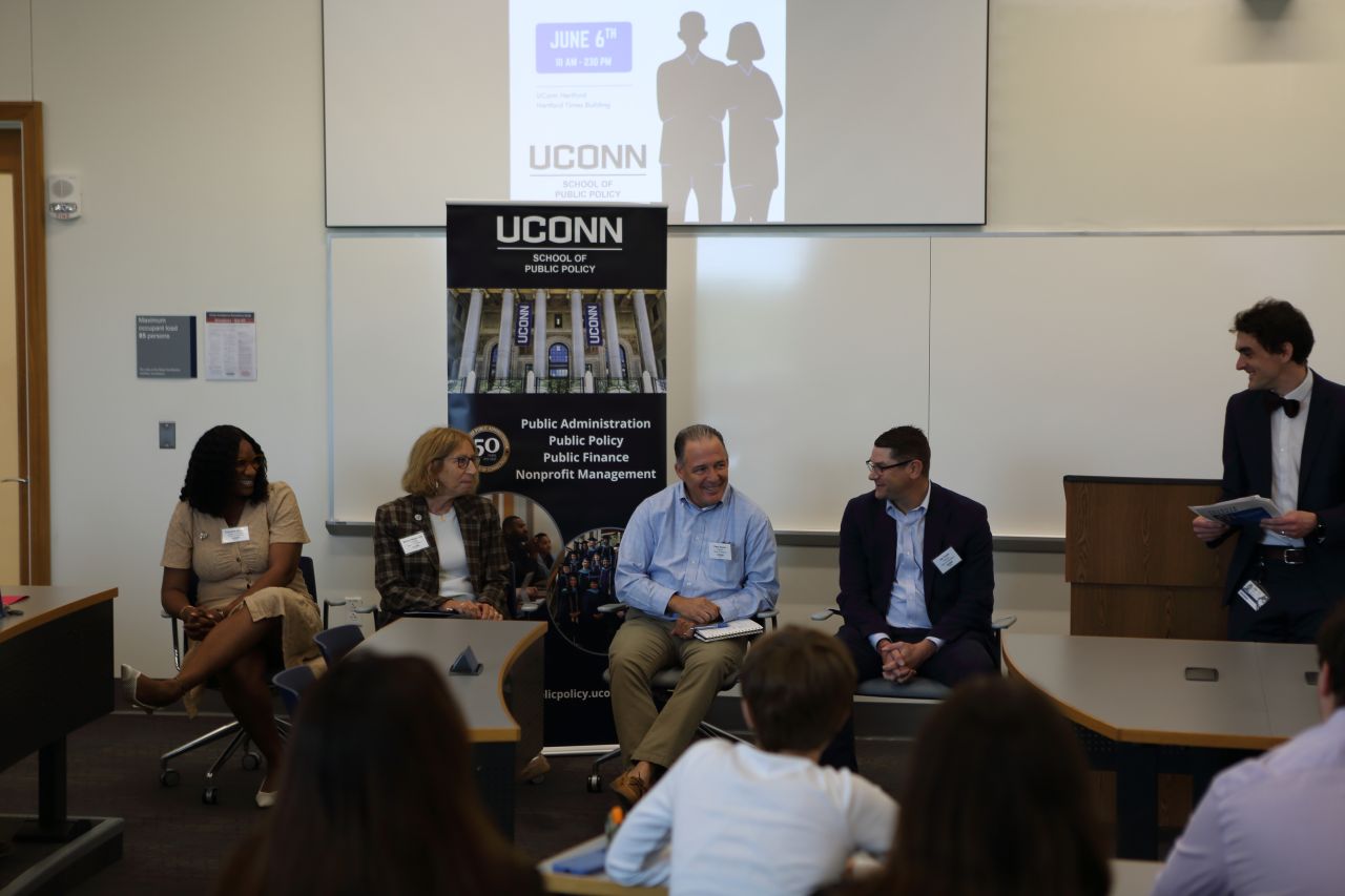 Photo of public service professionals speaking on a career panel, speaking to undergraduate students competing in UConn SPP Local Government Management case competition in June 2026.