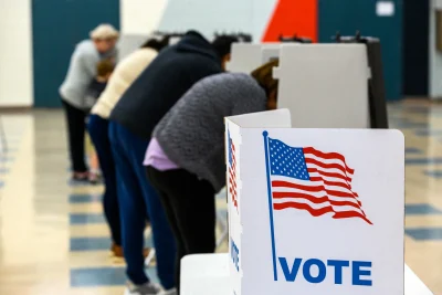 Voters fill out their ballots November 08, 2022, at the Manchester High School polling station.